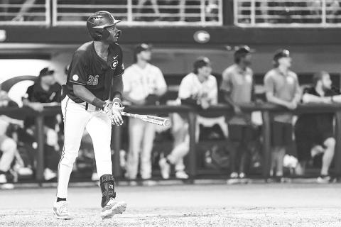 Georgia’s Tre Phelps watches his 8th inning solo home run sail over the wall against Georgia Tech on Sunday night. KARI HODGES/UGAAA