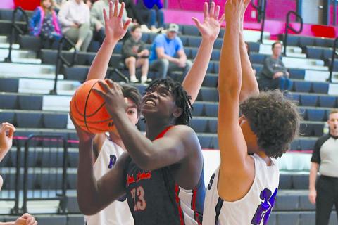 Josiah McCurry gets surrounded by defenders during a game last year. He will get plenty of attention from colleges during his senior year. FILE