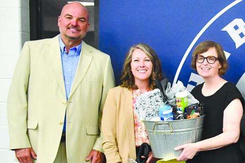 Shown (from left) are Superintendent Matthew Cooper, new North Habersham Middle School Principal Renee Crandall, North Hab Teacher of the Year Tiffany Collins at a banquet earlier this year. JULIANNE AKERS/File