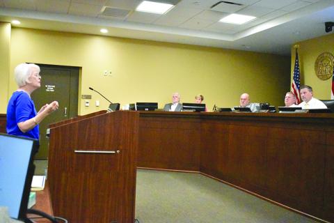 Paula Hannington of Clarkesville talks about the budget while the Board of Commissioners listens at Monday’s meeting. MATTHEW OSBORNE/Staff