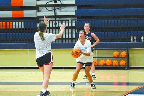 Katie Roberts pulls up for a corner 3 during open gym earlier this week. LANG STOREY/Staff