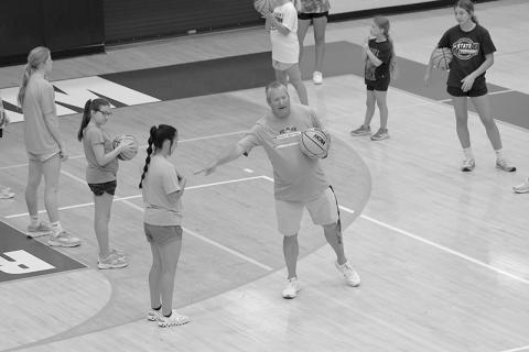 HCHS Coach Bill Bradley instructs campers ahead of a drill at basketball camp this week. LANG STOREY/Staff