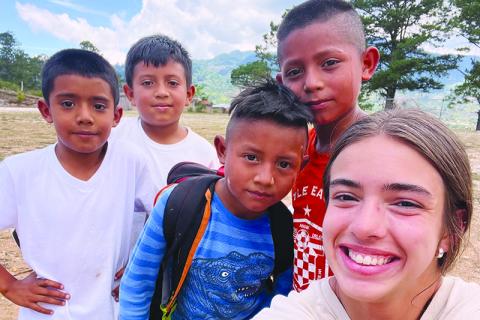 Kyia Barrett takes a selfie with a group of Honduran children during her mission trip with Level Grove Baptist Church. KYIA BARRETT/Submitted