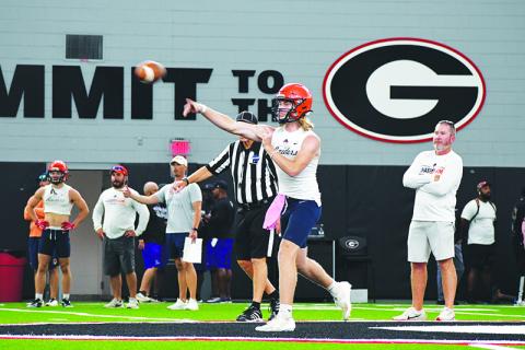  DJ Pass lets it fly during a Wednesday afternoon 7-on-7 game at UGA’s Indoor Athletic Facility. LANG STOREY/Staff