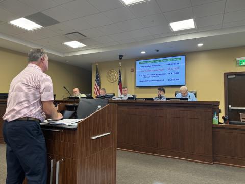 County CFO Tim Sims explains the budget consensus to the commissioners Monday.