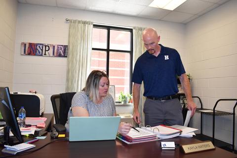 Habersham Central Principal Dr. Adam Bagwell talks with guidance counselor Kayla Waters earlier this week in preparation for the coming school year.