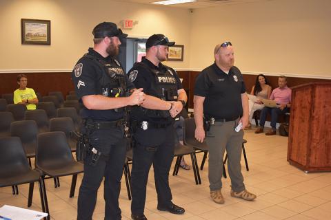 Baldwin  Assistant Police Chief Justin Ferguson (right) and Sgt. Aaron Spivey (left) introduce new officer Logan Ivester to the city council Monday.
