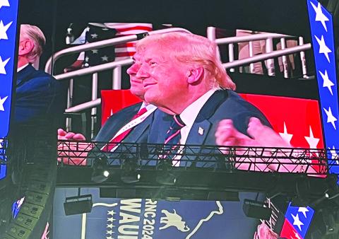 Donald Trump takes in a speech at the Republican National Convention on the big screen. CARL BLACKBURN/Submitted