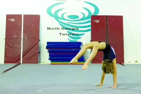 Bella Hunter practices a front walk-over in June. ZACH TAYLOR/Special