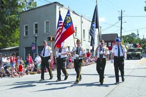 Grant-Reeves Post 7720 Honor Guard Captain Jim Morgan and members Dana McCloud, Rick Chaffin, Bill McAllister and Brady Morgan march in the Color Guard during the Demorest Fourth of July Festival. ZACH TAYLOR/Special