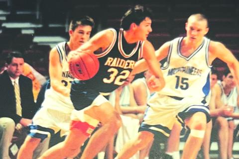 John Lacy drives by a defender at a tournament hosted by the University of Arkansas. FILE