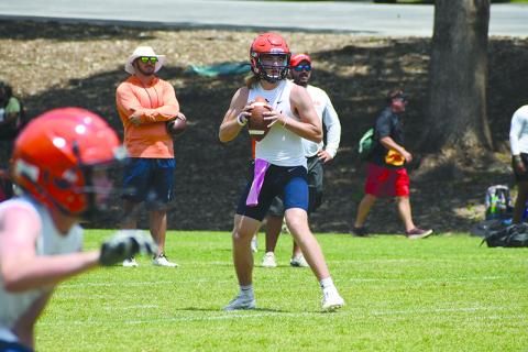 Raiders quarterback DJ Pass looks downfield while a receiver gets into position. LANG STOREY/Staff