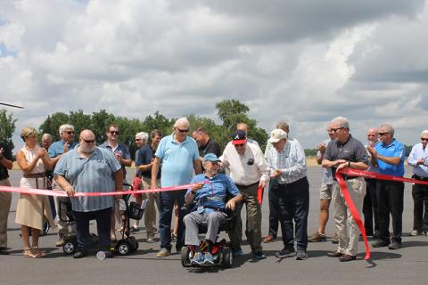 Habersham County Commissioner Jimmy Tench, Dean Swanson, retired Sen. John Foster, Don Higgins and Ken Schubring cut ribbon to celebrate the airport’s new runway Tuesday. BRIAN WELLMEIER/Special 