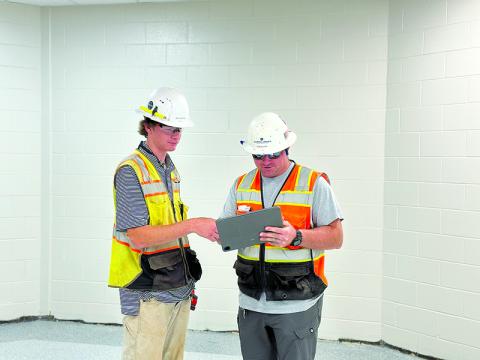 Jack Horton and Drew Atha discuss plans for renovations at Clarkesville Elementary construction site. CARROLL DANIEL CONSTRUCTION/Courtesy 
