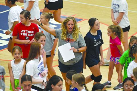 Lady Raiders varsity coach Lindsay Herrin gives instructions at Future Raider Volleyball Camp on Thursday morning. LANG STOREY/Staff