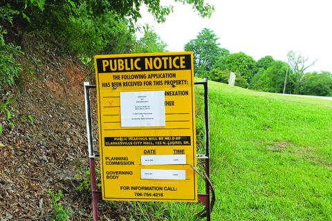 A sign marks the spot of the proposed Rocky Branch Road housing development in Clarkesville. The matter will be addressed at an Aug. 13 meeting. BRIAN WELLMEIER/Staff