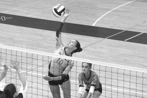 Ava Saxon makes a play at the net at White County on Tuesday. LANG STOREY/Staff