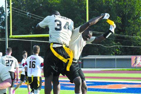 Tedarrius Teasley and Tomorea McGlockling of the Habersham-Banks team celebrate an interception Saturday. LANG STOREY/Staff