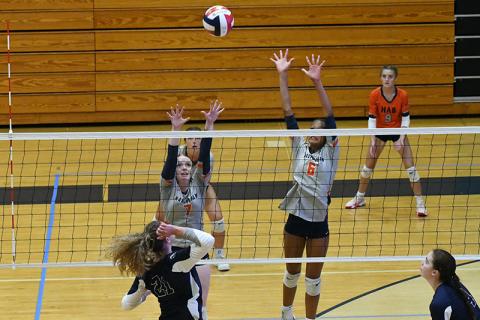 Habersham’s Katelynn LuBuono (left) and McKenzie King go up for a block during a match last week. LANG STOREY/Staff