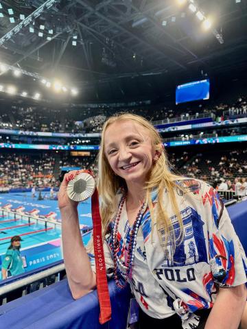 Coan shows off her medal at the Paris Games this summer. SUBMITTED
