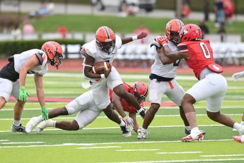 Antonio Cantrell cuts upfield thanks to a key block from Donnie Warren. TOM ASKEW/Special