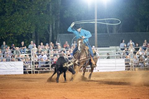 Tyler and Trevor Boatwright set a time of 6.1 to win the weekend in team roping. The brothers were the most cohesive team in the arena on Friday night. Trevor Boatwright is getting the heel toss lined up. ZACH TAYLOR/Staff 