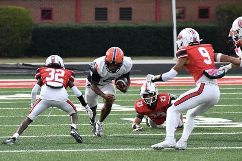 Donnie Warren slices through several Loganville defenders during Habersham’s dominant win Friday night. LANG STOREY/Staff