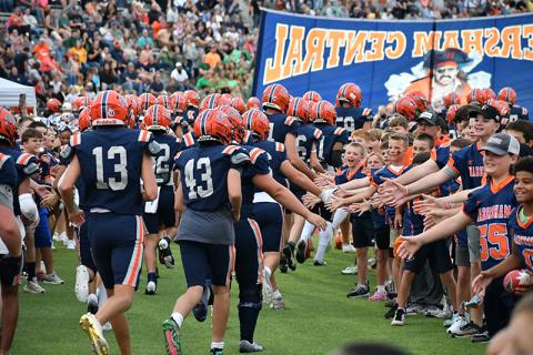 Youths from the Habersham Rec Dep’t formed a tunnel for the Raiders to run through prior to Friday night’s game. LANG STOREY/Staff
