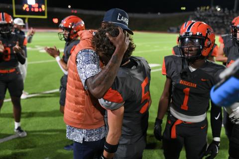 Tavarres King congratulates WR Zeke Whittington after Whittington became HCHS' all-time receiving yards leader Friday night. TOM ASKEW/Special