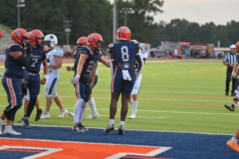 The Raider offense celebrates after Antonio Cantrell (No. 8) finds the endzone in a game earlier this season. TOM ASKEW/Special