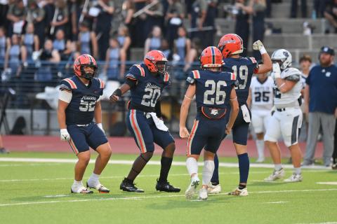 Raider defenders (from left) Anthony Garrido, Griffin Cunningham, Noah Harkins, and Everett Rudeseal celebrate a big stop earlier this season. TOM ASKEW/Special