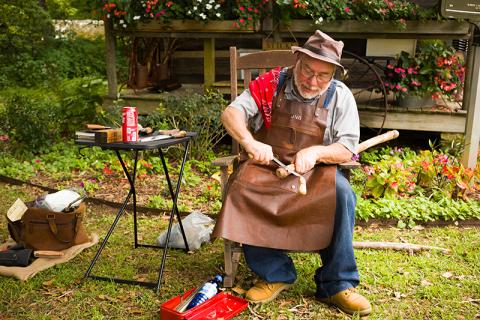 Jeff Blackwell carves into a cane during a previous event at the Mauldin House in Clarkesville. ZACH TAYLOR/Staff