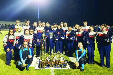 The Band of Blue stands with their hard-earned trophies at the Golden River Marching Festival on Oct. 19. SUBMITTED 
