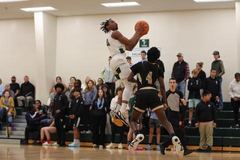 TFS’ Neyo Bain drives to the hoop during a game last season. AUSTIN POFFENBERGER/Special