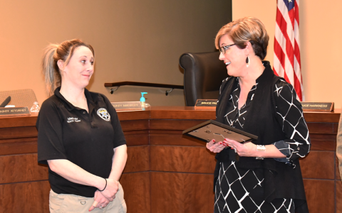 County Manager Alicia Vaughn (right) presents a plaque to Animal Control Director Madi Nix as part of the county’s employee recognition program. MATTHEW OSBORNE/Staff