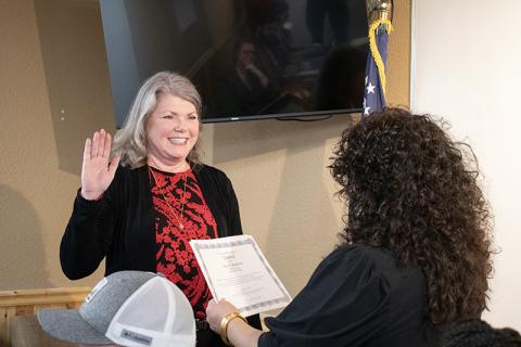 Nancy Lehman gets sworn into Baldwin City Council on Tuesday by Mayor Stephanie Almagno. JULIANNE AKERS/Staff 