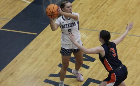 Habersham Central’s Makenzie Gosnell defends White County’s Emma Lightsey during the two teams’ matchup last week. The Lady Warriors squeaked past the Lady Raiders 56-54. MARK TURNER/White County News