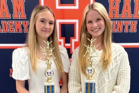 Mandi Simpson (left) and Jillian Tedder were named Cheerleaders of the Year at the Hab Central competition cheer banquet this week. SUBMITTED