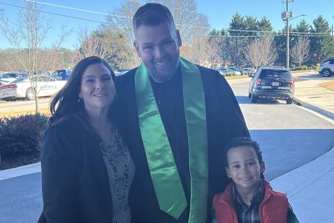 From left, Rachel and graduate Joey Newkirk stand with their son, Elijah, for a photo. Officer Newkirk said graduating with a college degree was his way of showing his son that he can accomplish whatever he puts his mind to. SUBMITTED