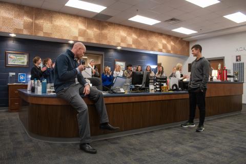Habersham Central Principal Dr. Adam Bagwell announces Joshua Burris as the 2025 STAR Student recipient for the school, as Burris’ peers clap for him behind the front office desk. HANNAH CAUDELL/Staff 