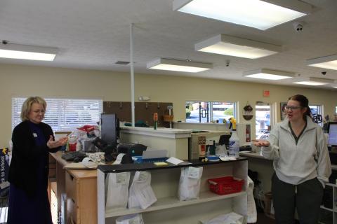 From left, Habersham Drug owner Deborah Gale stands behind the pharmacy counter with her daughter, Hannah. HANNAH CAUDELL/Staff