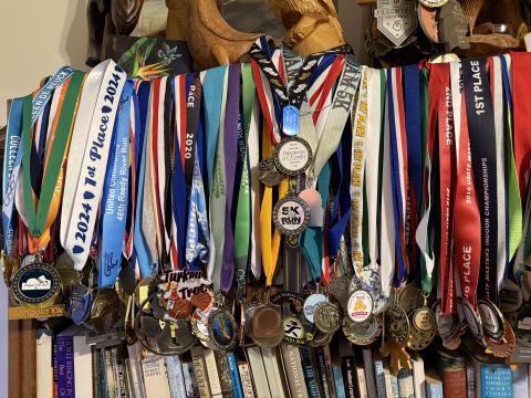 The Turner house in Clarkesville is home to hundreds of race medals acquired through the years. LANG STOREY/Staff