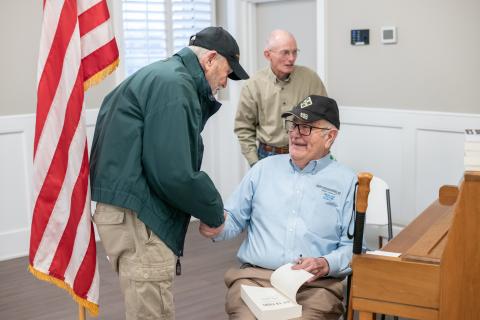 Jerry Lewis (left) shakes hands with Vietnam veteran Bob Babcock after the keynote address. ZACH TAYLOR/Staff
