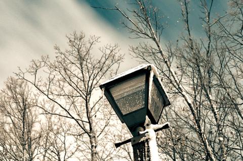 Icicles hang from a street light with snow accumulating on the post from high winds in recent years. ZACH TAYLOR/Staff