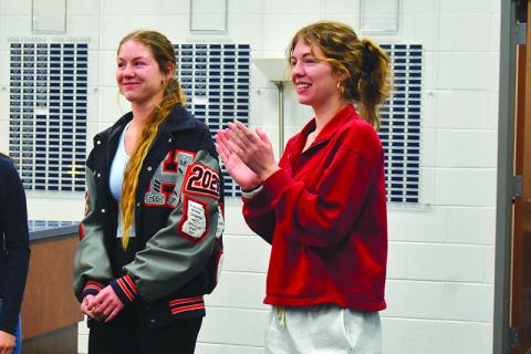 Abigail Hotard (right) claps as her sister, Audrey, is announced Habersham Central High School’s valedictorian Wednesday morning. Abigail was announced as the class salutatorian. Samantha Sinclair/Staff