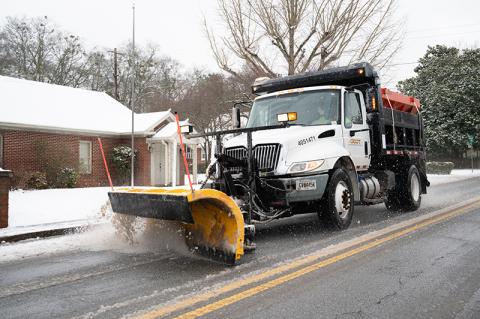 A GDOT plow makes its way down Washington Street in Clarkesville. ZACH TAYLOR/Staff