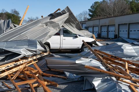 A truck at Cap’n Auto Parts is buried beneath rubble from the roof. ZACH TAYLOR/Staff