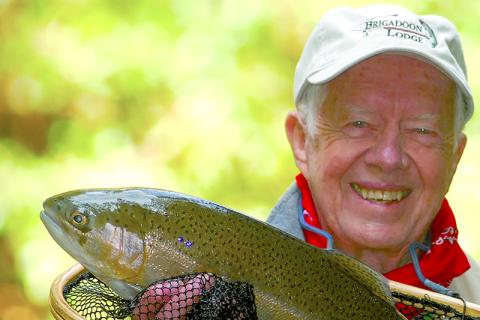 Jimmy Carter proudly shows a fish he caught in local waters. “He is holding an Oyster rod that I specially commissioned for him,” Rebekah Stewart said. “It is one of only two rods I ever commissioned.” SUBMITTED