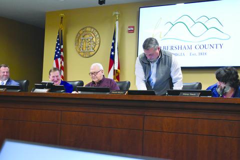 Immediately following the election of chairman, commissioners Jimmy Tench, Ty Akins and Dustin Mealor switched seats so Tench could take his place as chairman. Samantha Sinclair/Staff