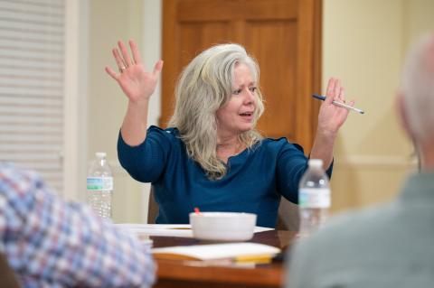 Councilwoman Angelia Kiker raises her hands joyfully after the city’s unanimous vote to purchase the old courthouse for $1.19 million. Kiker was the main force behind the historic purchase. ZACH TAYLOR/Staff